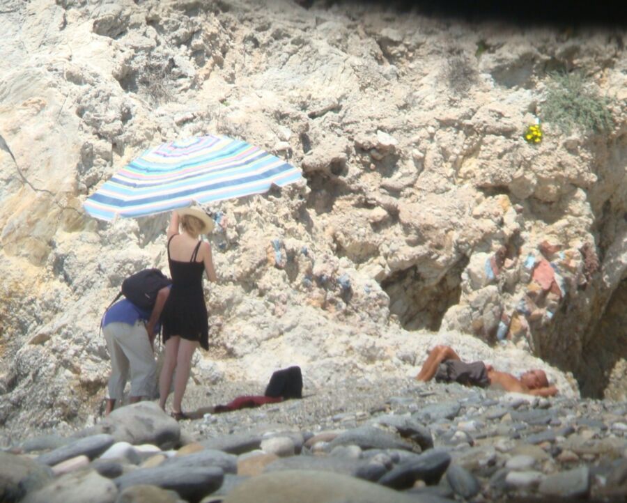Hot young French girl spied stripping on the beach 1 of 14 pics