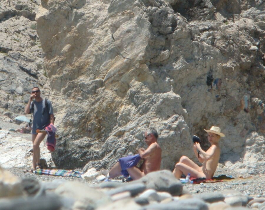 Hot young French girl spied stripping on the beach 14 of 14 pics