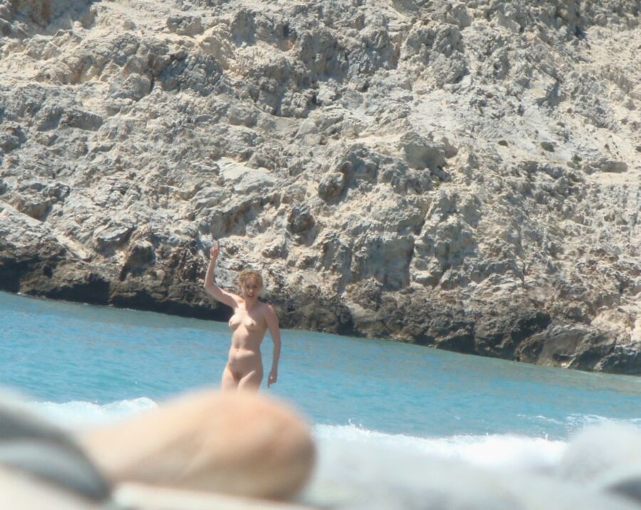 Hot young French girl spied stripping on the beach 6 of 14 pics