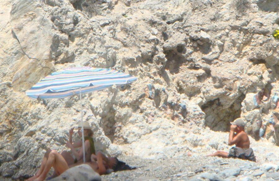 Hot young French girl spied stripping on the beach 5 of 14 pics