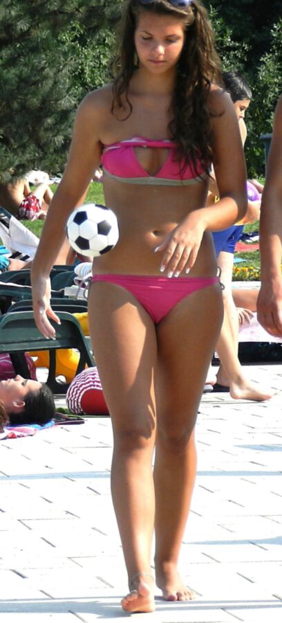 Free porn pics of Long-haired teen with long tanned thighs in pink bikini 3 of 5 pics