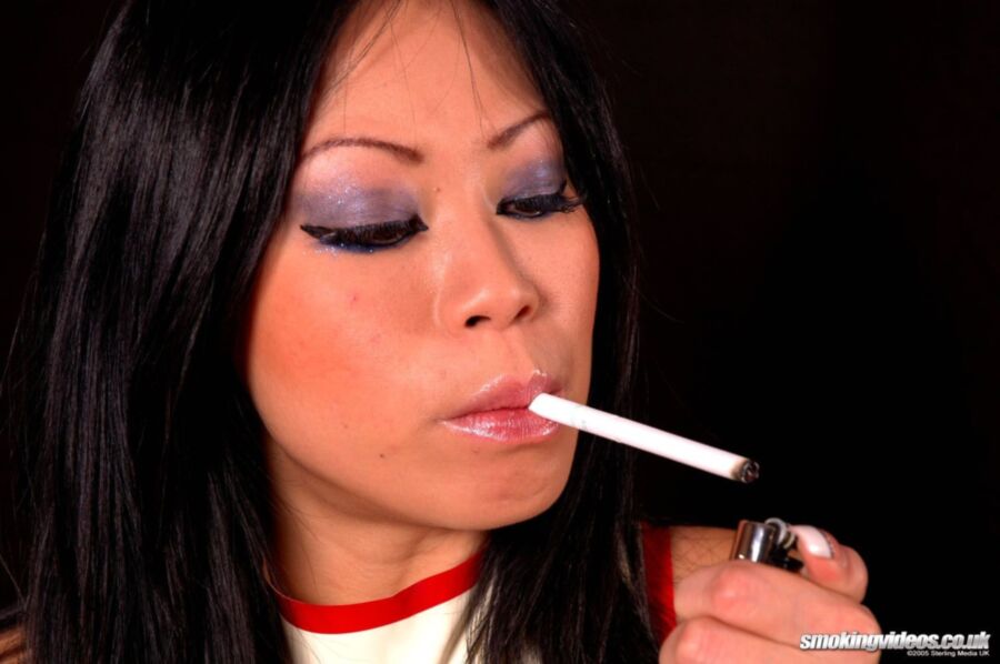 Free porn pics of Asian Smoking In Latex 8 of 60 pics