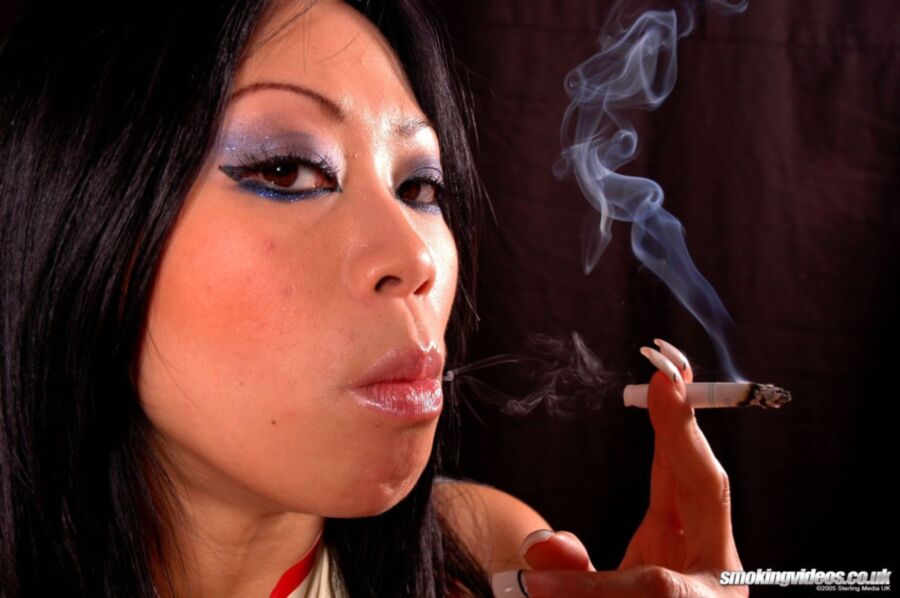 Free porn pics of Asian Smoking In Latex 3 of 60 pics