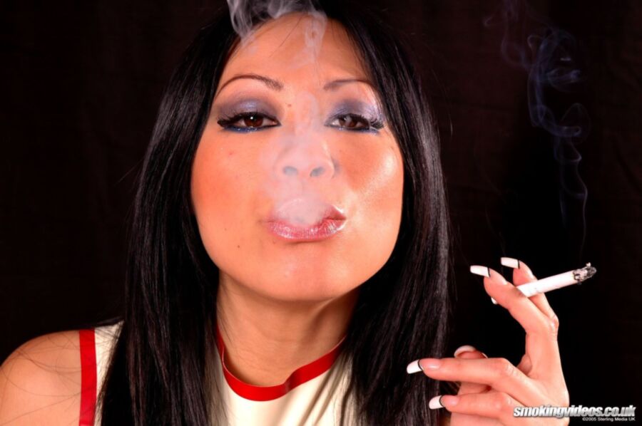 Free porn pics of Asian Smoking In Latex 12 of 60 pics