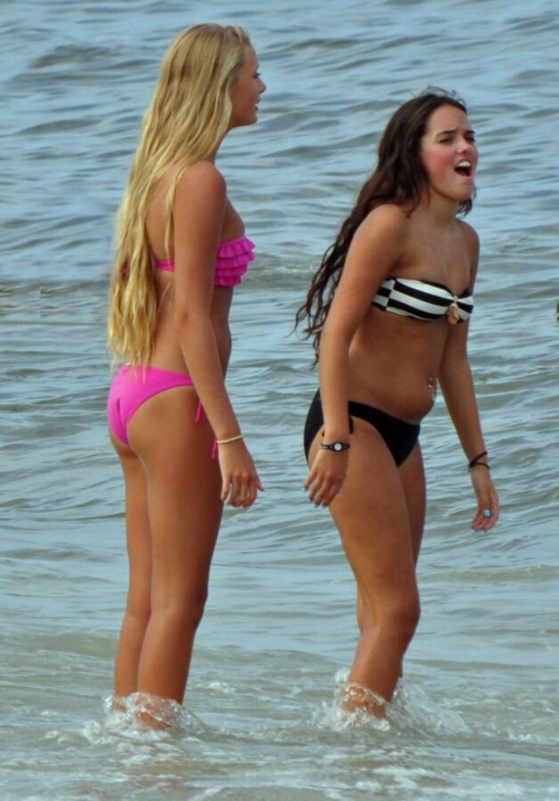 Free porn pics of Long-haired teen blonde and brunette - sexy pair at the sea 11 of 12 pics